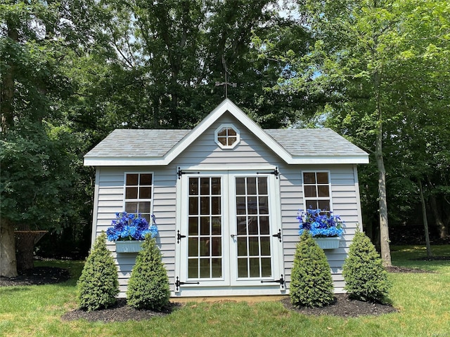 view of outbuilding with a yard