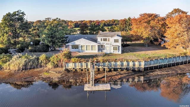 rear view of house with a water view