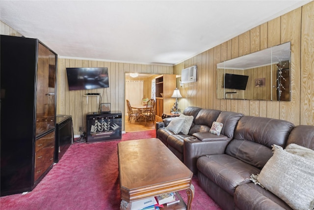 carpeted living room with an AC wall unit, crown molding, and wood walls