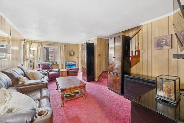 carpeted living room featuring crown molding and wooden walls