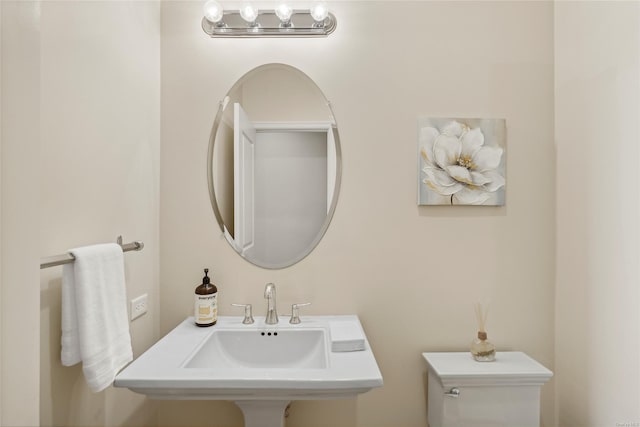 bathroom featuring sink and toilet