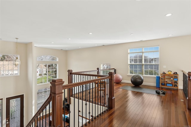 exercise room with dark hardwood / wood-style floors