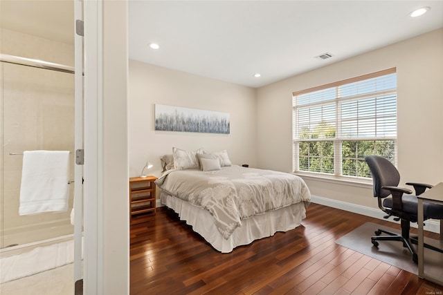 bedroom with dark hardwood / wood-style floors