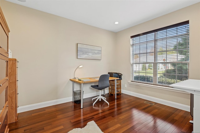 home office with dark wood-type flooring