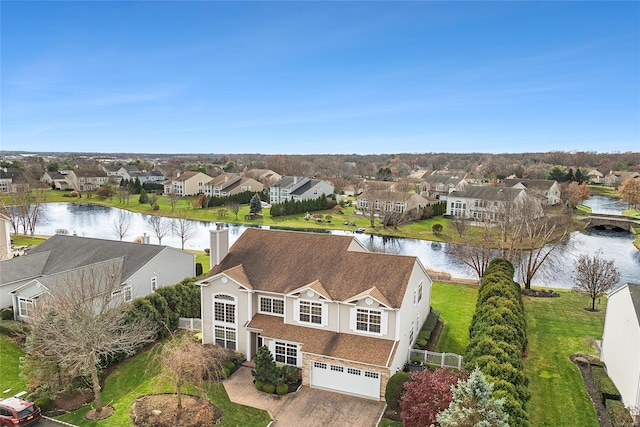 birds eye view of property featuring a water view