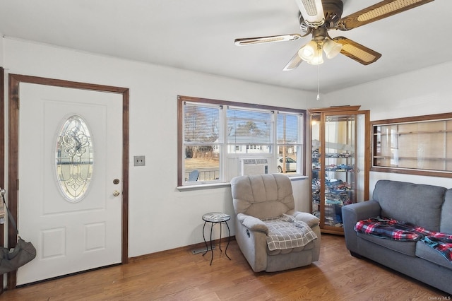 entrance foyer featuring hardwood / wood-style flooring and ceiling fan