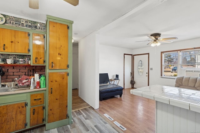 bedroom featuring ceiling fan and light wood-type flooring