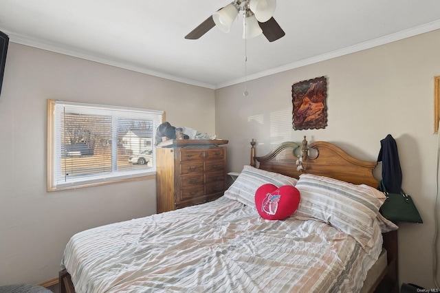 bedroom with ceiling fan and ornamental molding