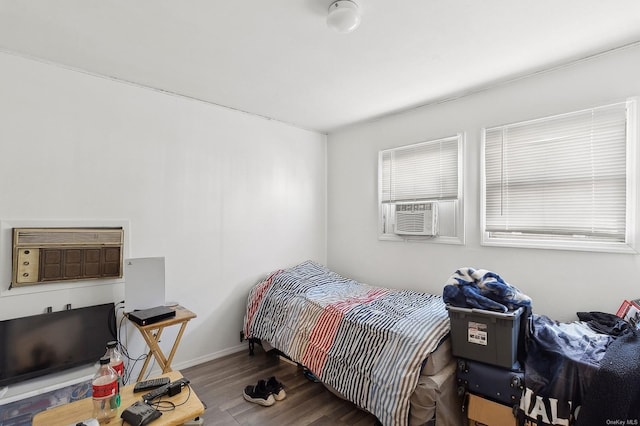 bedroom featuring cooling unit and hardwood / wood-style flooring