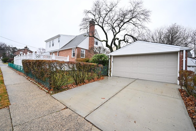 exterior space featuring an outbuilding and a garage