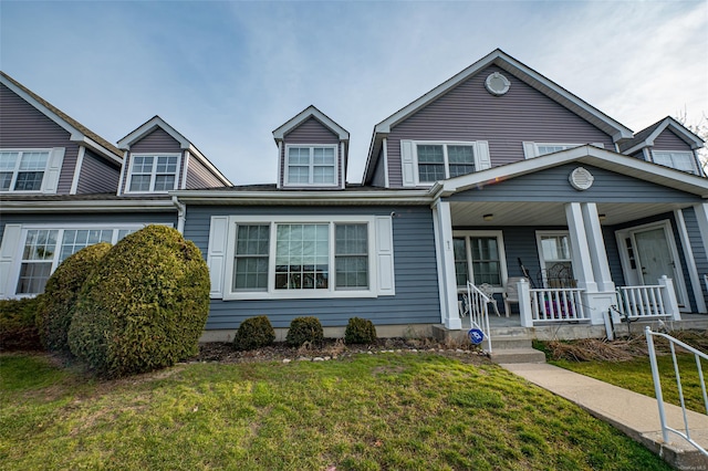 811 Spring Lake Dr Unit 811, Middle Island, NY 11953 - view of front of home with covered porch and a front lawn