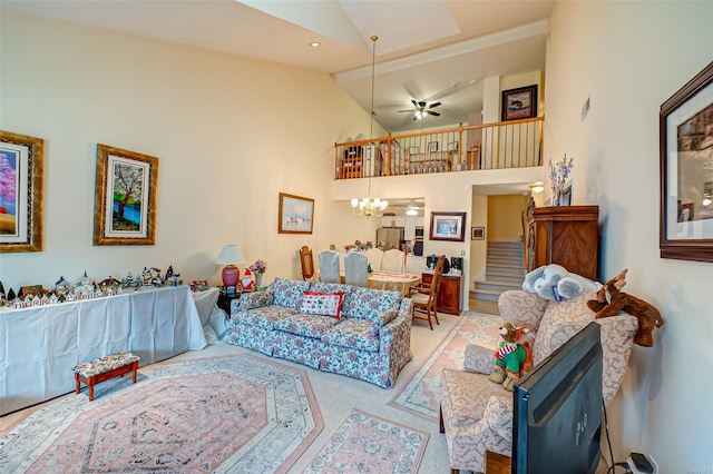 811 Spring Lake Dr Unit 811, Middle Island, NY 11953 - living room with stairway, a chandelier, ceiling fan, high vaulted ceiling, and carpet