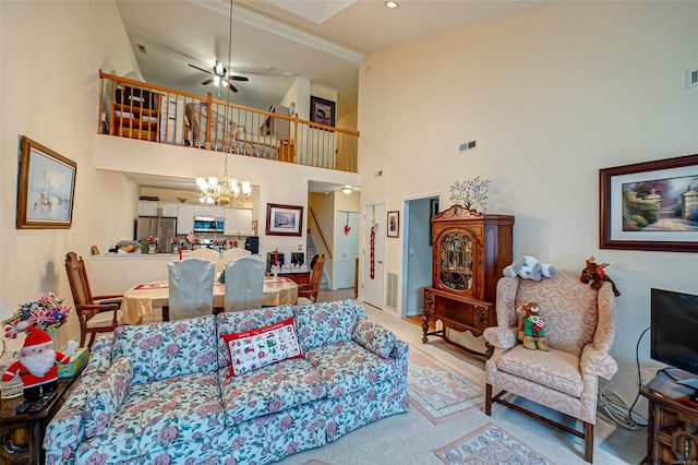 811 Spring Lake Dr Unit 811, Middle Island, NY 11953 - living area featuring a chandelier, stairway, light colored carpet, a high ceiling, and a ceiling fan