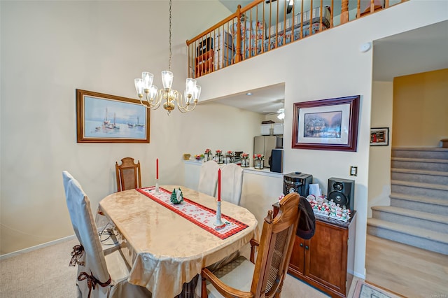 811 Spring Lake Dr Unit 811, Middle Island, NY 11953 - dining space with a chandelier, stairs, a towering ceiling, and carpet flooring