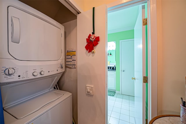 811 Spring Lake Dr Unit 811, Middle Island, NY 11953 - washroom with stacked washer / drying machine and light tile patterned flooring