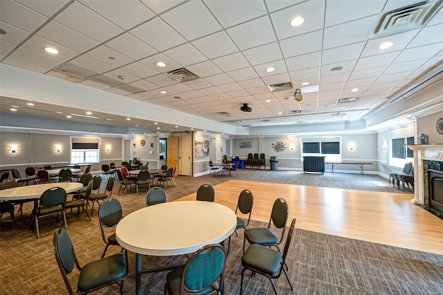 811 Spring Lake Dr Unit 811, Middle Island, NY 11953 - carpeted dining space with a glass covered fireplace and recessed lighting