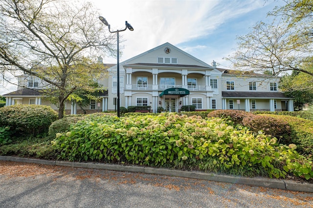 811 Spring Lake Dr Unit 811, Middle Island, NY 11953 - greek revival house featuring a balcony