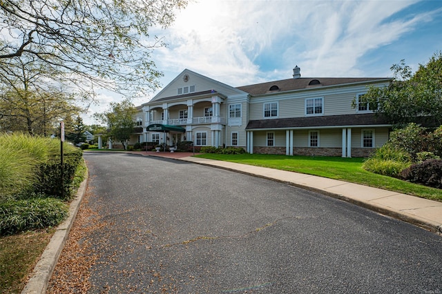 811 Spring Lake Dr Unit 811, Middle Island, NY 11953 - view of front of property featuring stone siding and a chimney