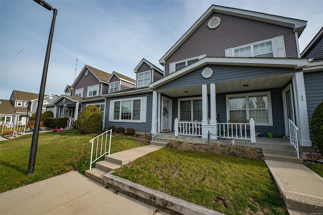 811 Spring Lake Dr Unit 811, Middle Island, NY 11953 - view of front of house with covered porch, a front yard, and a residential view