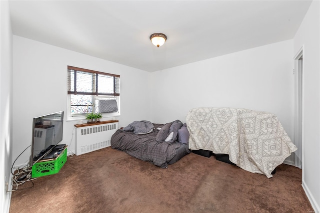 carpeted bedroom featuring radiator heating unit