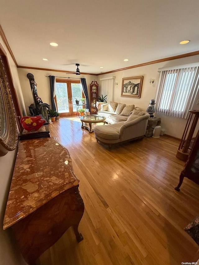 living room featuring ornamental molding, french doors, and hardwood / wood-style floors