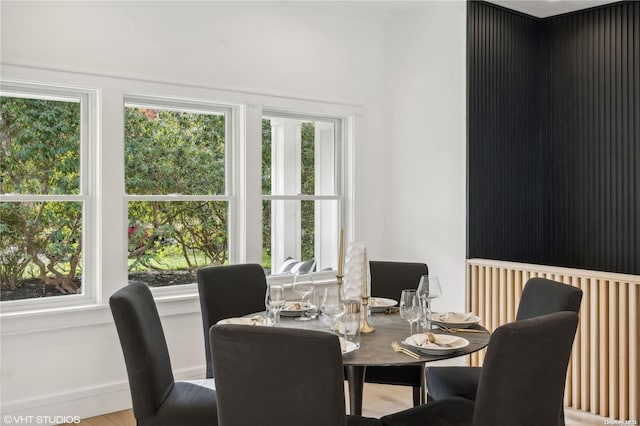 dining area with a healthy amount of sunlight and wood-type flooring