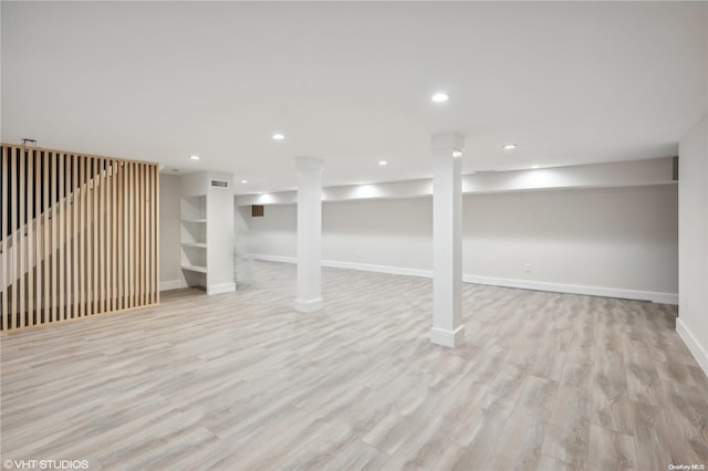 basement featuring light hardwood / wood-style flooring