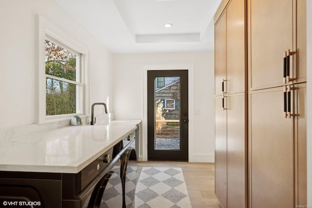 interior space with cabinets and light wood-type flooring