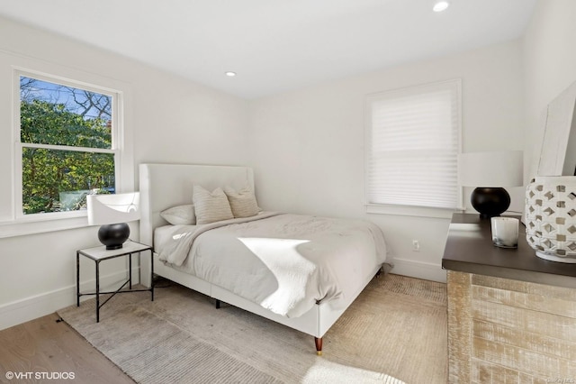 bedroom with wood-type flooring