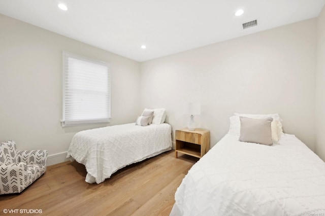 bedroom with hardwood / wood-style flooring