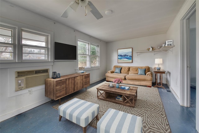 living room featuring dark hardwood / wood-style flooring, a wall unit AC, and ceiling fan