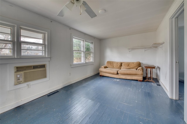 unfurnished room with ceiling fan, an AC wall unit, and dark wood-type flooring