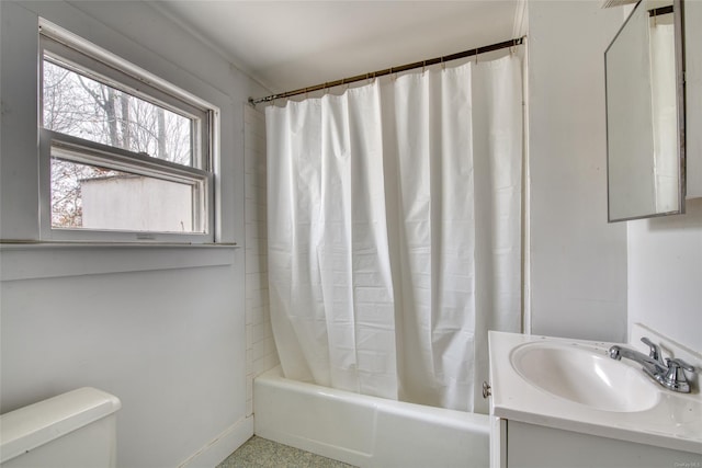 full bathroom featuring shower / bath combo with shower curtain, vanity, and toilet