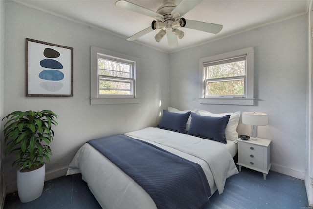 bedroom featuring multiple windows, ceiling fan, and dark wood-type flooring