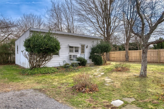 view of side of property featuring a yard