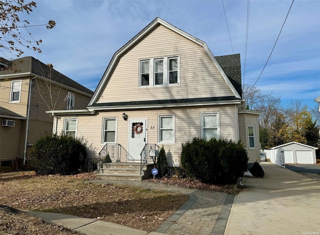 view of front facade with a garage and an outdoor structure