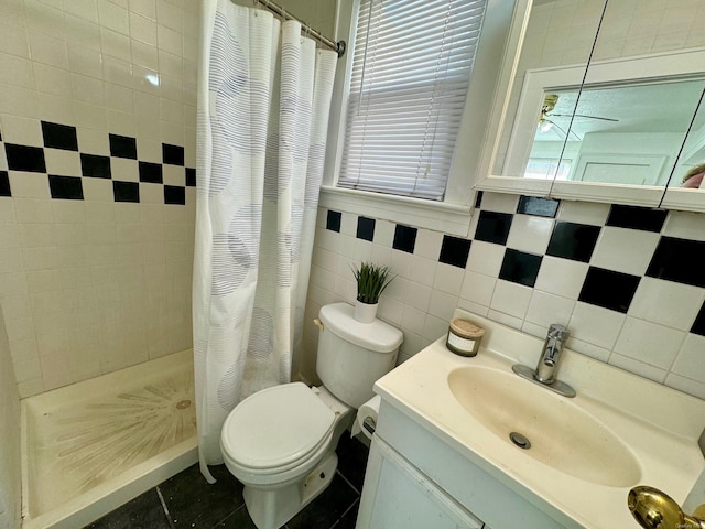 bathroom featuring a shower with curtain, tile patterned flooring, vanity, and tile walls