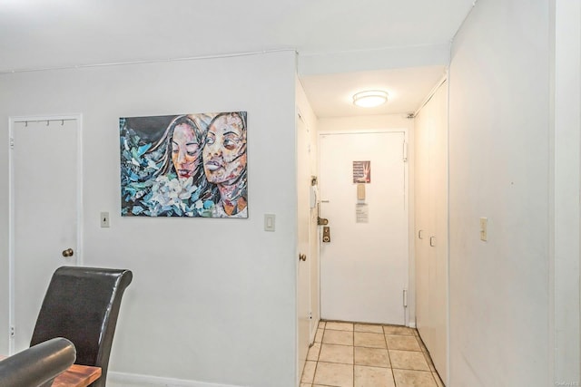 corridor with light tile patterned floors