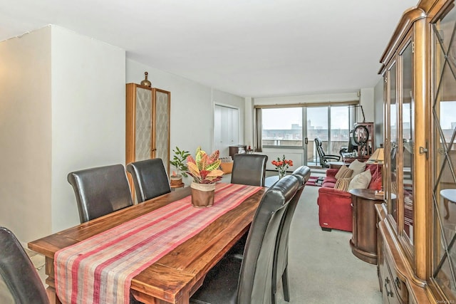 view of carpeted dining area