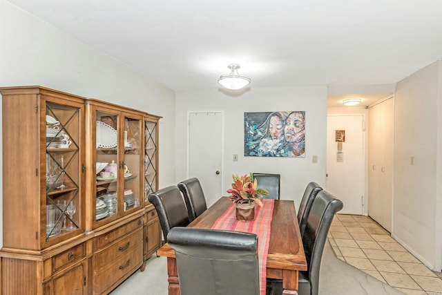 dining area featuring light tile patterned floors