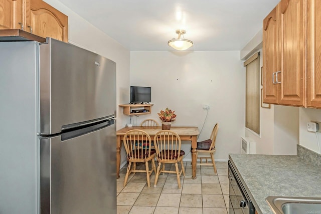 kitchen with stainless steel fridge, dishwasher, and light tile patterned floors