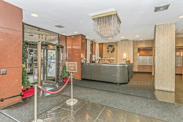 welcome area with a chandelier