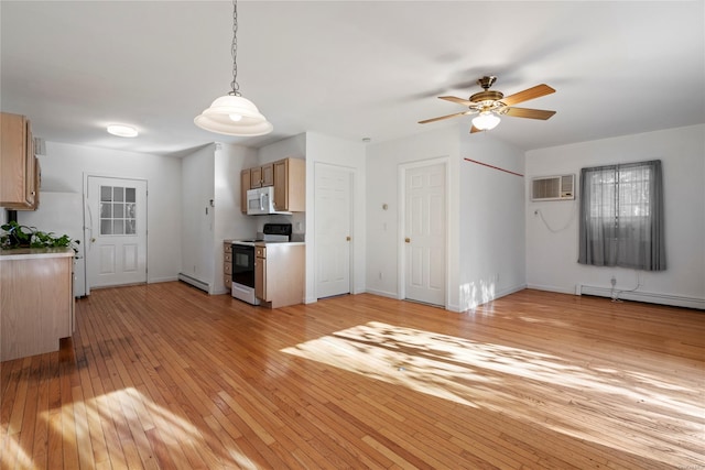 kitchen with light wood-type flooring, white appliances, baseboard heating, and light brown cabinetry