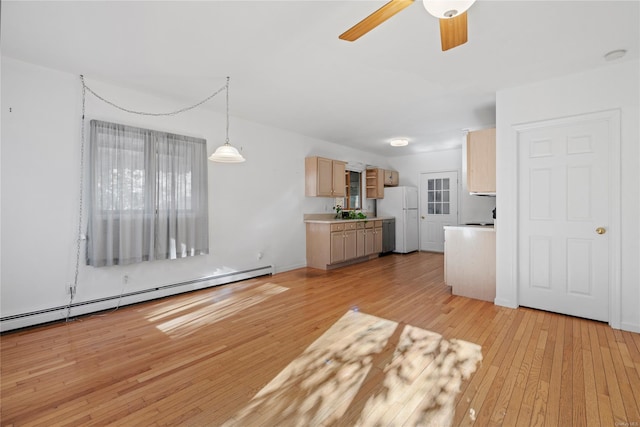 unfurnished living room with light wood-type flooring, ceiling fan, and a baseboard heating unit