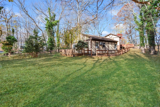 view of yard with a wooden deck