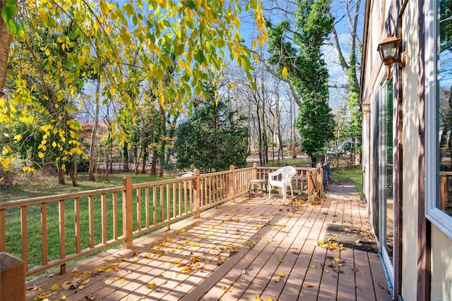 deck featuring a lawn