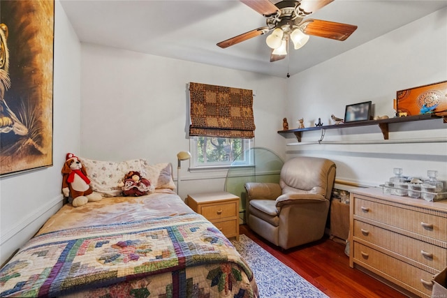 bedroom featuring dark hardwood / wood-style flooring and ceiling fan