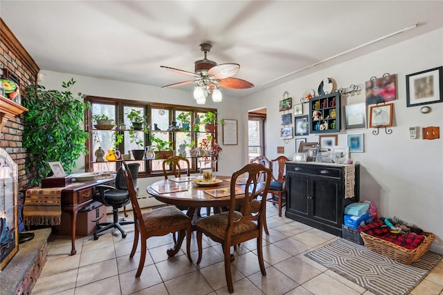 dining space with ceiling fan and light tile patterned floors