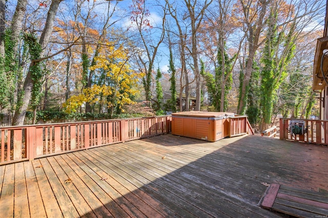 wooden terrace with a hot tub