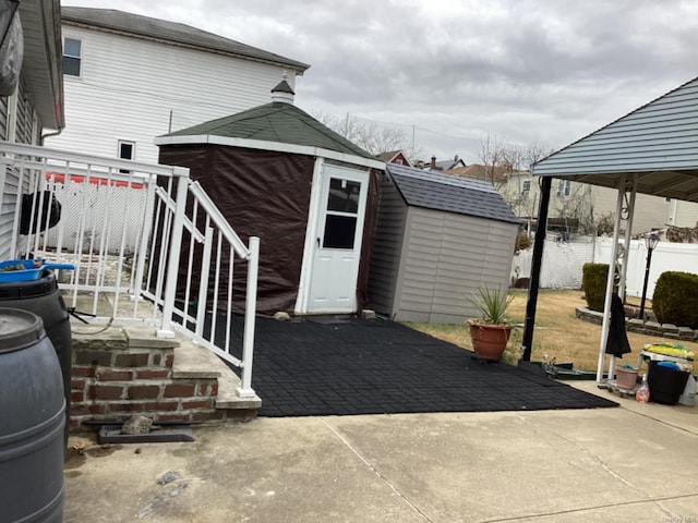 exterior space featuring a gazebo and a shed